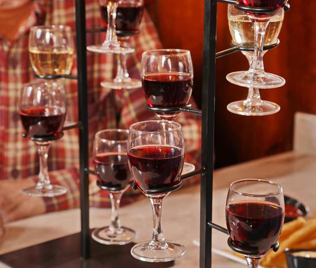 Glasses of red wine on a plaid table at the Community Restaurant