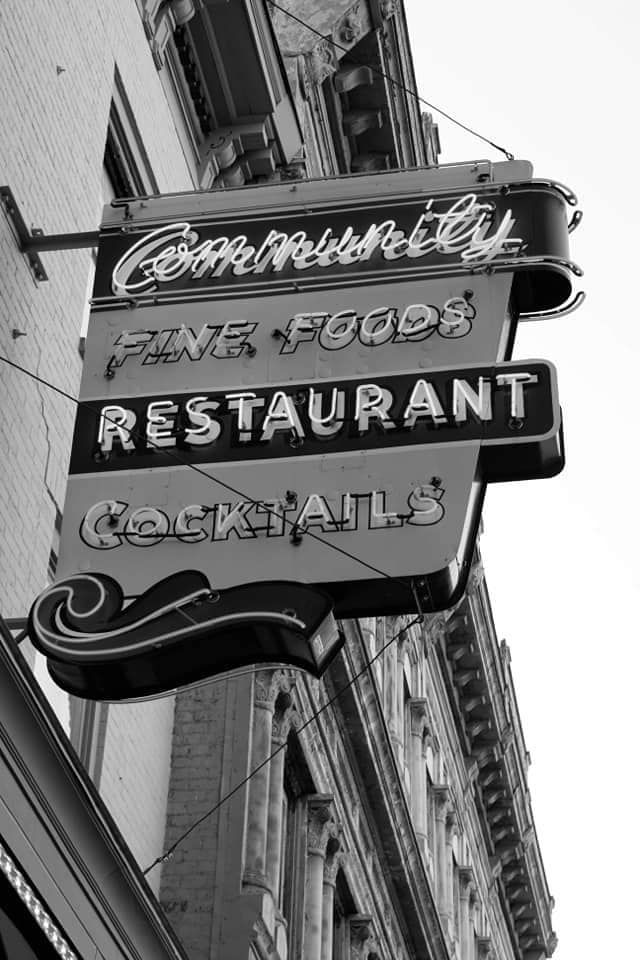 The Community Fine Foods Restaurant sign seen from the street